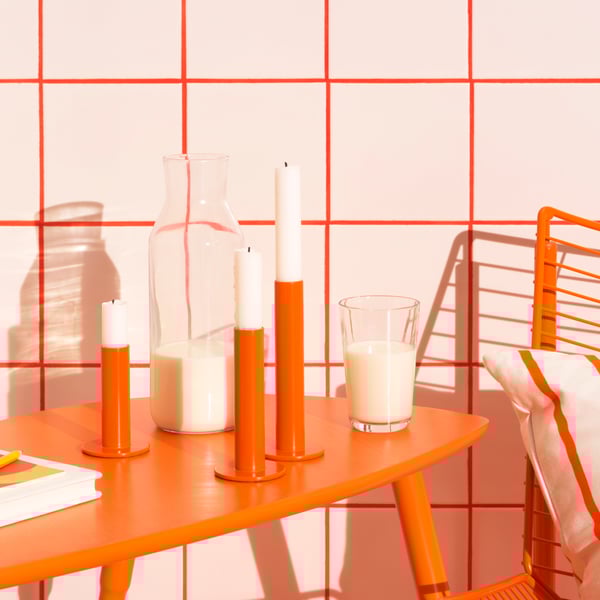 An orange LÖVBACKEN side table